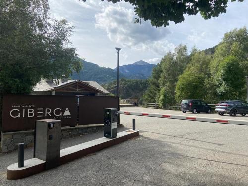 a sign on the side of a road with cars at Apartaments Giberga in LʼAldosa