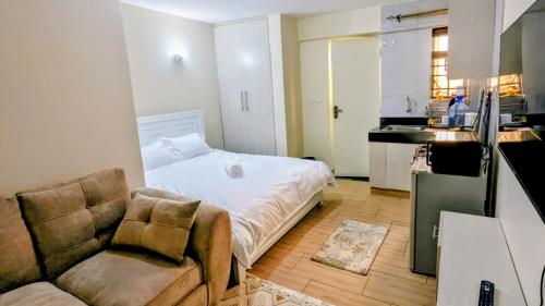 Ένα ή περισσότερα κρεβάτια σε δωμάτιο στο Krystal suites