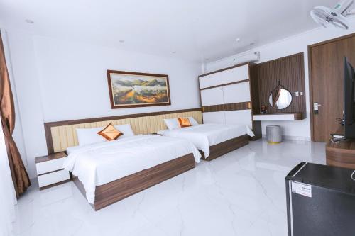 Katil atau katil-katil dalam bilik di An Khang Hotel