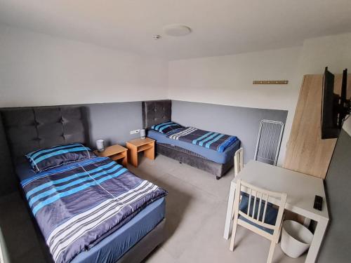 Postel nebo postele na pokoji v ubytování Boardinghouse Wildbachtal
