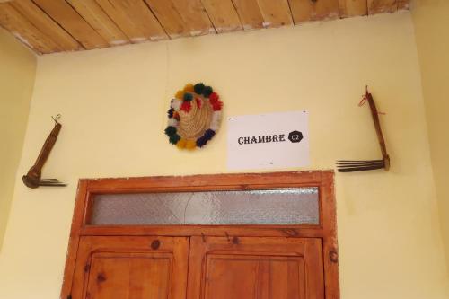 a door in a room with a sign above it at Gite Megdaz in Megdaz