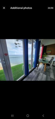 a picture of a room with a view of the ocean at Beach house near ochi Rios and Ian Fleming airport in Salt Gut Pen