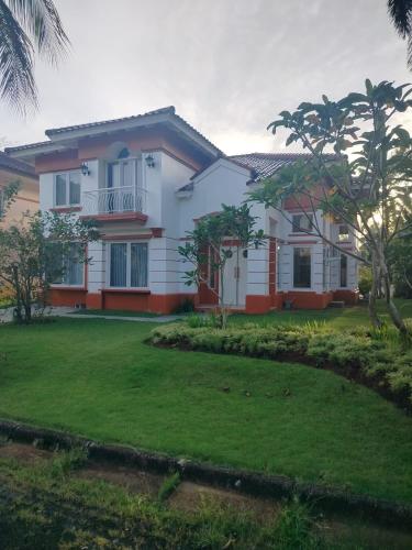 a house with a lawn in front of it at LaGita Carita Beach Villa 2 in Carita