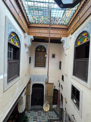 a hallway of a building with a glass ceiling at Riad Le panoramique in Fès