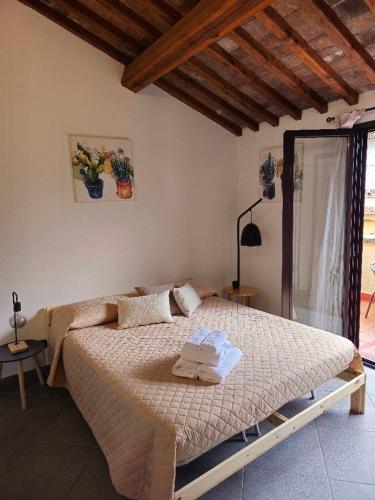 Letto o letti in una camera di Palazzetto dei Priori