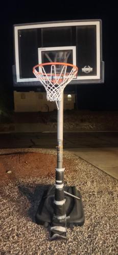 a basketball hoop with a net on a floor at Paradise home with king bed & room for the family in Lake Havasu City