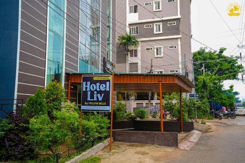 een hotelluxebord voor een gebouw bij Hotel Liv By Yellow Bells in Hyderabad