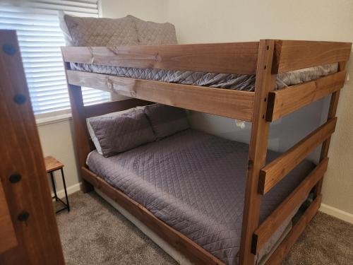 a couple of bunk beds in a room at Paradise home with king bed & room for the family in Lake Havasu City