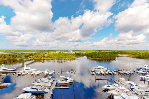 a group of boats docked in a marina at The Wharf 912 in Orange Beach