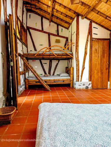 a room with two bunk beds in a room at Hotel La Casa de Francois in San Agustín