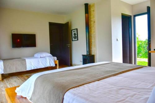 Letto o letti in una camera di Mantadia Lodge Andasibe