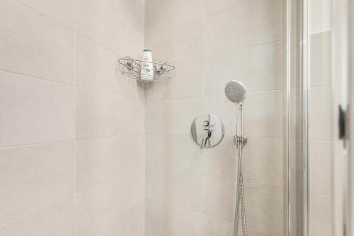 a shower with a shower head in a bathroom at Trilocale riammodernato vicino a Venezia & Riviera in Mestre