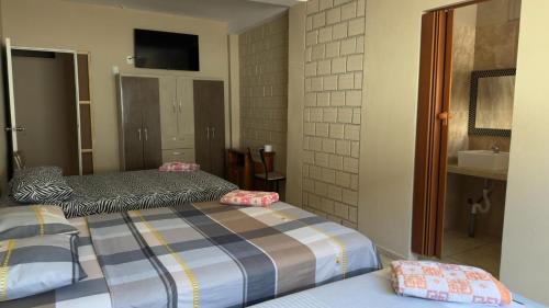 Кровать или кровати в номере Casa de Perú Iquitos- Hotel & Restaurant