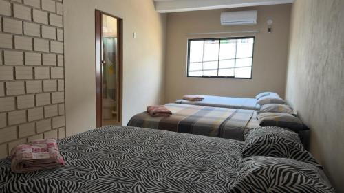Кровать или кровати в номере Casa de Perú Iquitos- Hotel & Restaurant