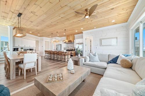 a living room with a couch and a table at Sundune in Gulf Shores