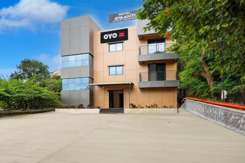 a large building with a sign on it at Hotel O Avaanti in Pune