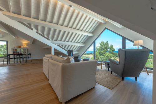 a living room with a couch and two chairs at Ápice - by Azores Green Villas in São Vicente Ferreira