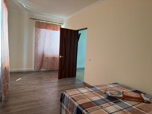 Postel nebo postele na pokoji v ubytování Garden House Apartments