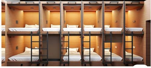 a group of bunk beds in a room at Hostel 18 Pokhara lakeside in Pokhara