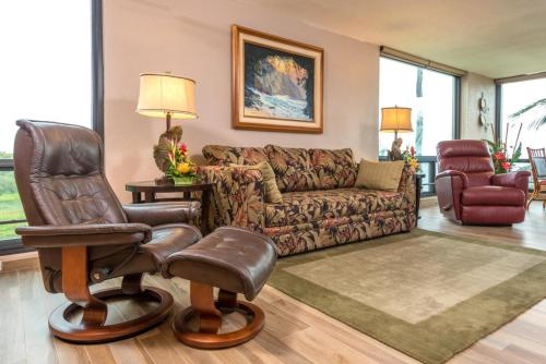 a living room with a couch and a chair at Mahana by KBM Resorts in Kaanapali