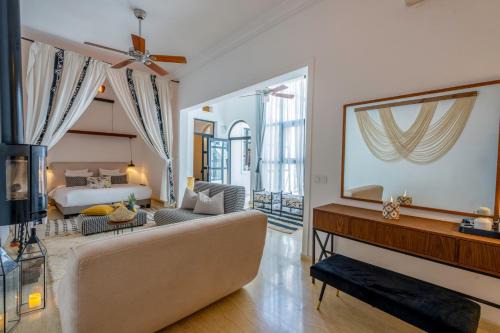 a living room with a couch and a bed at Maison H Kasbah in Marrakech