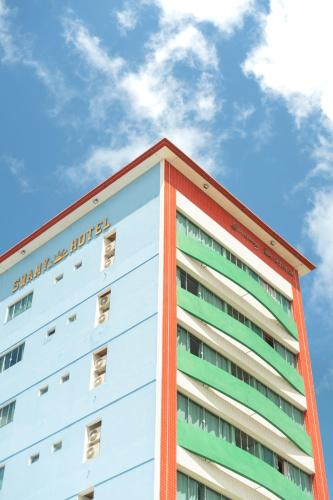 a building with the words sarajevo hotel at Swamy Hotel in Cruzeiro do Sul