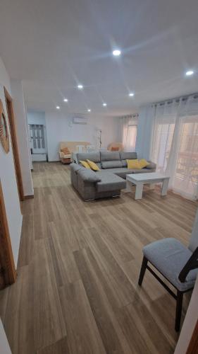a living room with a couch and a table at Alojamiento Paco Cabrera 3C Reformado in Almuñécar