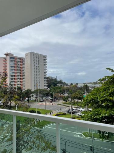 a view of a city from a balcony at Praia do Canto Apart Hotel - Vista para o Mar 102A in Vitória