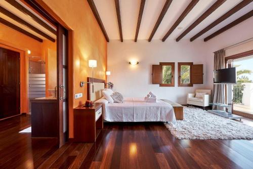 a large bedroom with a bed and a large window at Exclusive 4 Bedroom Villa in Mahon 1281 in Sant Carles de Peralta