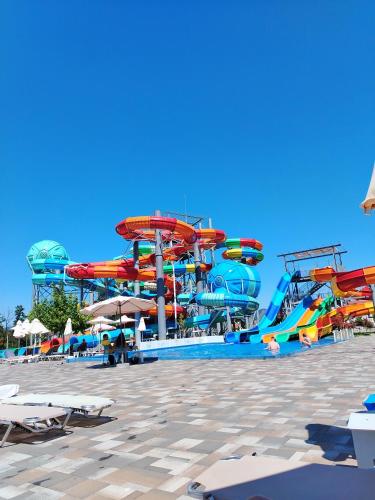 a water park with a colorful water slide at Apartman Amber Vrnjačka Banja in Vrnjci