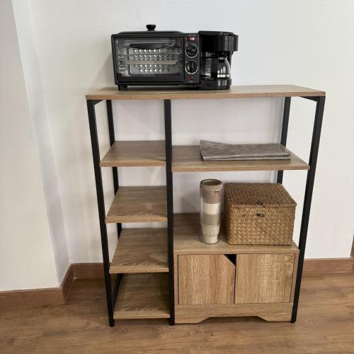 a shelf with a radio on top of it at Med Time Hotel Boutique in Calpe