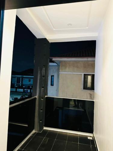 a view of a balcony with a view of a building at Nova rise apartments in Ibeju