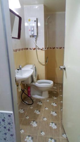 a bathroom with a toilet and a sink at Smart Residence@Muengthongthani in Nonthaburi