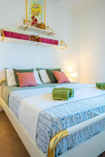 Una cama o camas en una habitación de Pina'Mmari