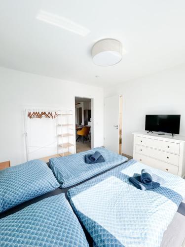 Postel nebo postele na pokoji v ubytování Ferienwohnung in Ahaus für 6 Gäste mit 2 Bädern und Loggia