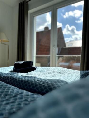 Postel nebo postele na pokoji v ubytování Ferienwohnung in Ahaus für 6 Gäste mit 2 Bädern und Loggia