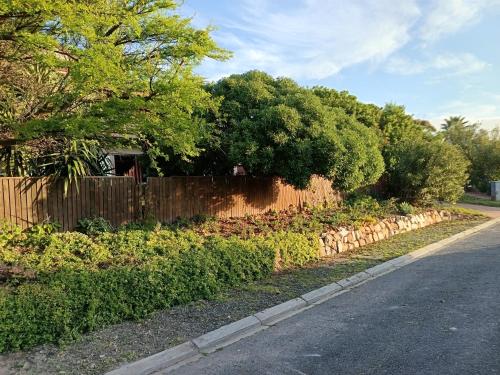 a fence on the side of a road at Happy Homes - Imhoffs Gift in Imhoffʼs Gift