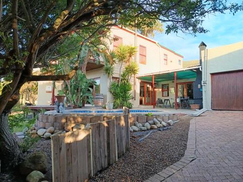 a backyard with a fence and a house at Happy Homes - Imhoffs Gift in Imhoffʼs Gift