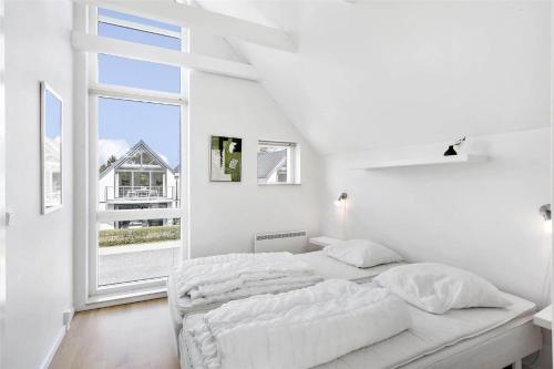 Postel nebo postele na pokoji v ubytování M13004-Vaeggerlose-Marielyst-Strandvej-63-K