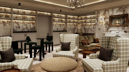 a waiting room with chairs and a table at Cambridge Common House in Cambridge