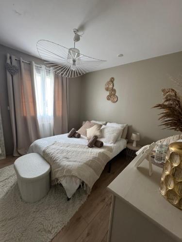 Ένα ή περισσότερα κρεβάτια σε δωμάτιο στο Chambres au calme