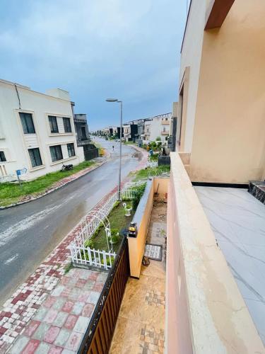 a view of a street from the balcony of a building at Cozy & comfy House in Rawalpindi