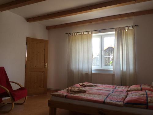 Postel nebo postele na pokoji v ubytování Apartmány Na Statku