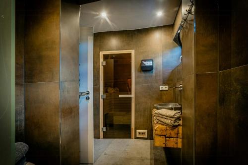 a bathroom with a shower with a glass door at Modern Chalet With Sauna Near Thuringian Forest in Zella-Mehlis