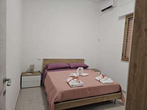 Кровать или кровати в номере Casa AnnaLu'
