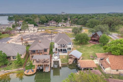 an aerial view of a house on the water at Stunning Luxury Home on Lake LBJ! in Horseshoe Bay