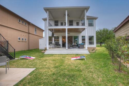 a house with three canoes in the yard at Stunning Luxury Home on Lake LBJ! in Horseshoe Bay