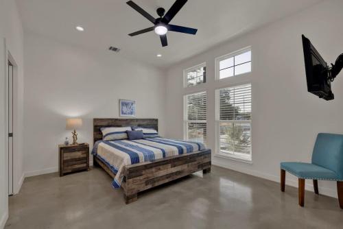 a bedroom with a bed and a ceiling fan at Serene Guadalupe River Getaway-River Access! in Cranes Mill