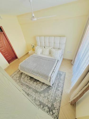 Postel nebo postele na pokoji v ubytování KK Homes