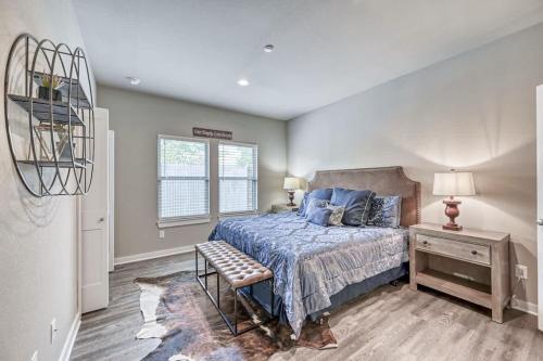 a bedroom with a bed and a table and a window at The Ricardo in Fredericksburg